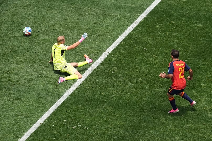 Spain's Mikel Oyarzabal, right, scores his side's 3rd goal during the World Cup round of 32 