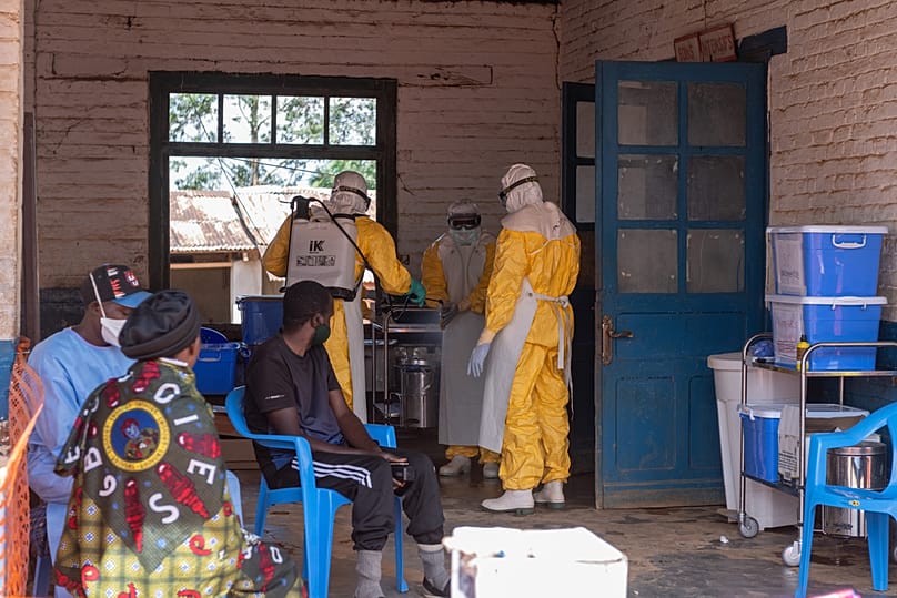 Health workers prepare for duty at the Mongbwalu treatment center in Mongbwalu, Congo, Friday, June 5, 2026. 