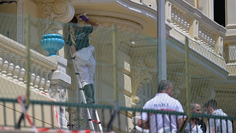 Investigators examine the scene at the residential building where an explosive device seriously injured three people in Monaco, 30 June, 2026