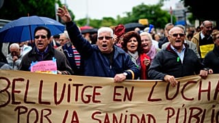 Pensioners and patients protest during the second day of the health workers strike in Bellvitge, Spain, Wednesday Nov. 16, 2011. 