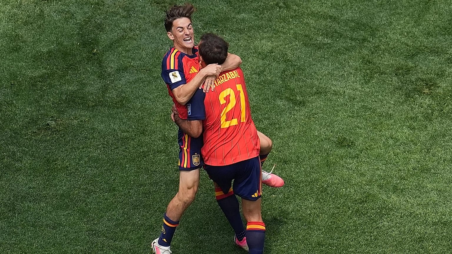Spain's Mikel Oyarzabal (21) celebrates scoring his side's 3rd goal with his teammate Gavi during the World Cup round of 32 soccer match between Spain and Austria in Inglewood