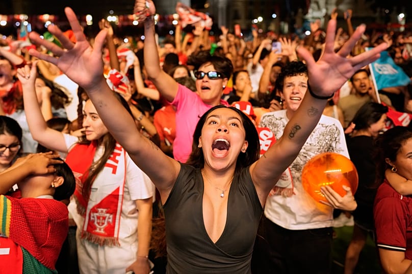 Fans watching on a big screen in Lisbon, Portugal, react after VAR disallowed a second goal by Croatia in the last minute, Friday, July 3, 2026 .