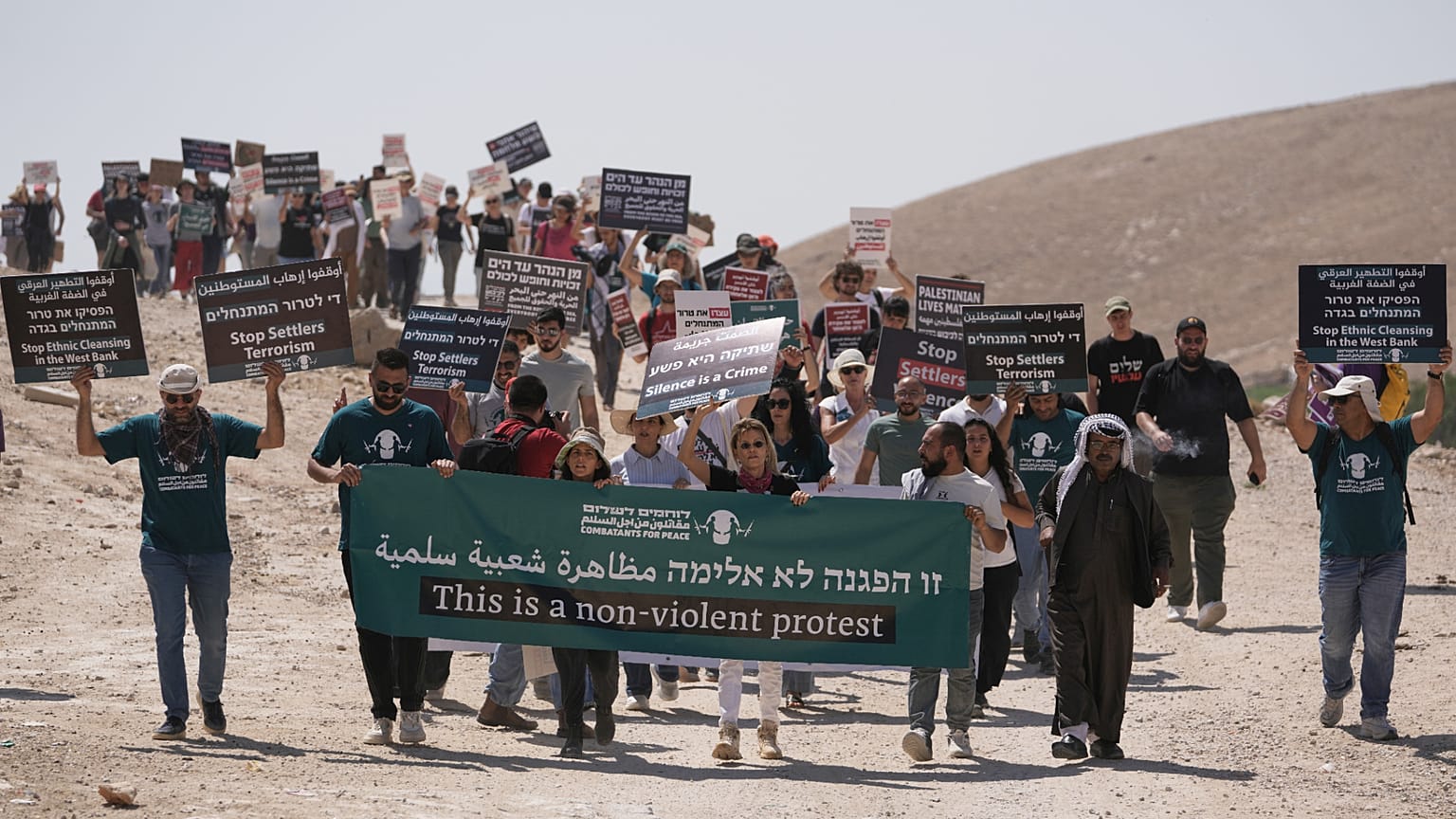 Israeli and international peace activists rally in support of the Bedouin communities of Khan al-Ahmar in the occupied West Bank Friday, June 12, 2026. 