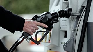 A Shell gas station customer pumps gas in Menlo Park, Calif., Wednesday, Dec. 2, 2009. (AP Photo/Paul Sakuma)