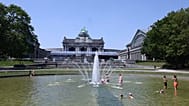 People wade in a fountain at the Cinquantenaire Park in Brussels, Thursday, June 25, 2026.
