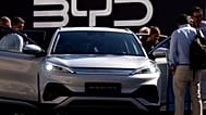 Visitors inspect a China made BYD ATTO 3 at the IAA motor show in Munich, September 2023.