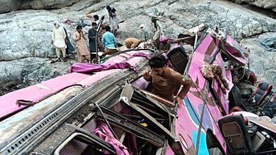 Rescue workers and volunteers cover bodies after a bus crash in Dana Sar, 3 July, 2026