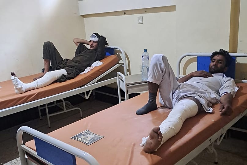 Injured passengers from a bus crash rest after receiving initial treatment at a hospital in Dana Sar, 3 June, 2026