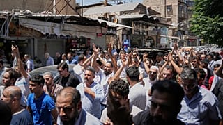 Mourners carry the coffin of one of the victims of an explosive device detonated in a cafe near Damascus' main courthouse, 3 July, 2026