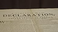 This image made from video shows a newly discovered copy of the U.S. Declaration of Independence, printed in July 1776 in Exeter, is displayed at The National Archives.