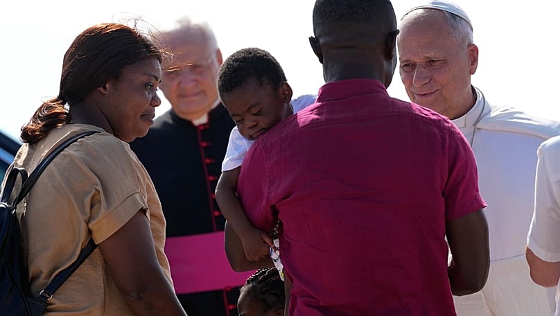 Pope Leo XIV meets a family of migrants at the Gateway of Europe monument in Lampedusa, Sicily, southern Italy, Saturday, July 4, 2026