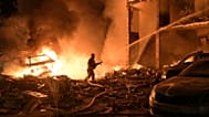 Emergency services personnel work to extinguish a fire following Russian missile attacks in Kyiv, Ukraine, Monday, July 6, 2026.