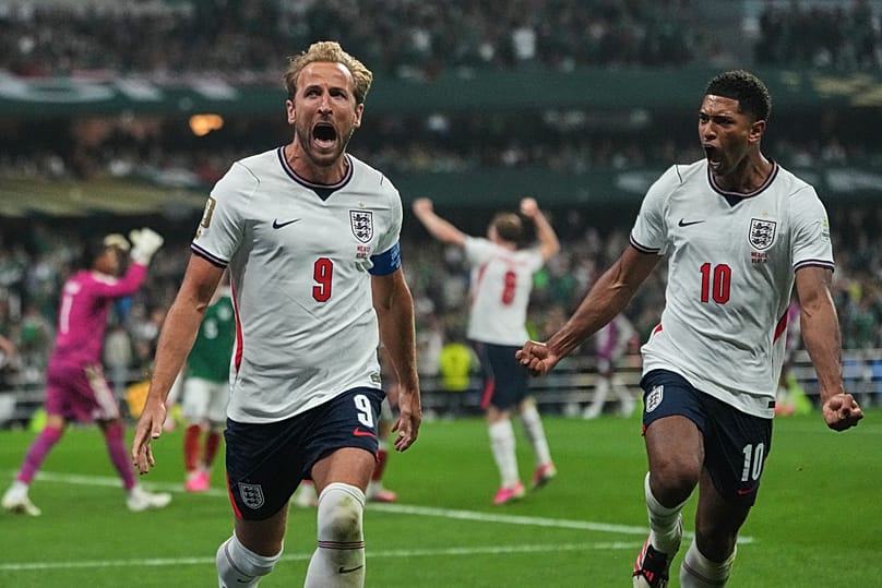 England's Harry Kane celebrates with Jude Bellingham after scoring his side's third goal during the World Cup round of 16 soccer match against Mexico, Sunday, July 5, 2026.