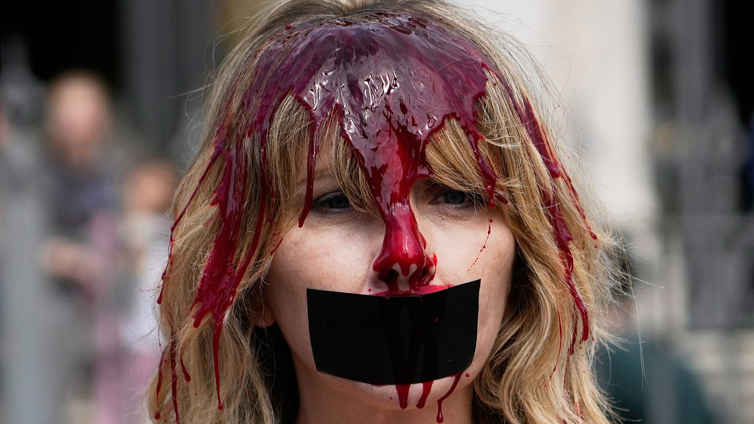 Rome, Thursday, April 30, 2026: Italian actress and PETA activist Loredana Cannata, covered in red paint, protests bullfighting outside St. Mary Major Basilica.