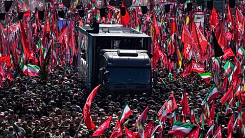 Tehran, Iran, July 6, 2026: The truck carrying the coffin of slain Iranian Supreme Leader Ayatollah Ali Khamenei moves along an avenue during the funeral procession in Tehran