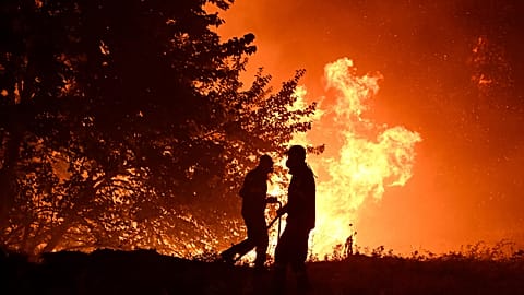 Firefighters work on a wildfire on the outskirts of the northern city of Thessaloniki, 5 July, 2026