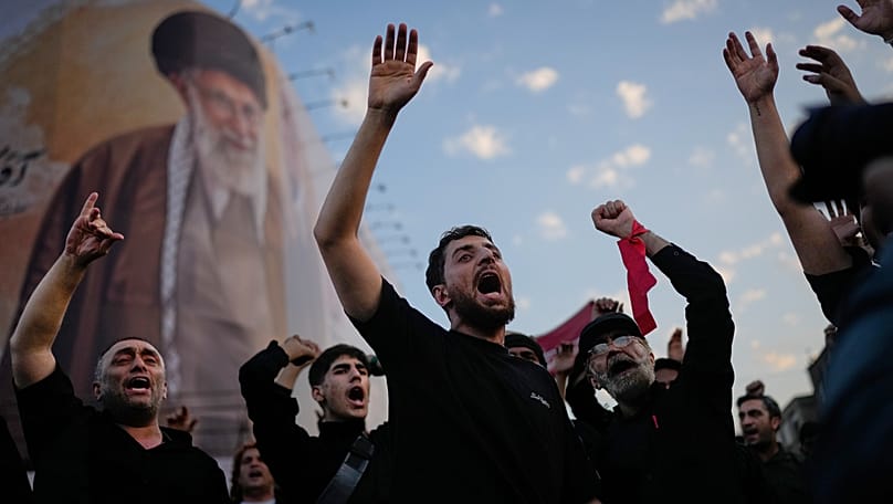 Mourners chant slogans while gathered in Islamic Revolution Square for the funeral procession of the slain Iranian Supreme Leader Ayatollah Ali Khamenei, Tehran, July 6, 2026