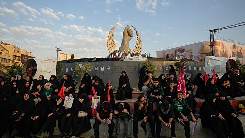 Mourners wait in Islamic Revolution Square for the funeral procession of the slain Iranian Supreme Leader Ayatollah Ali Khamenei, Tehran, July 6, 2026