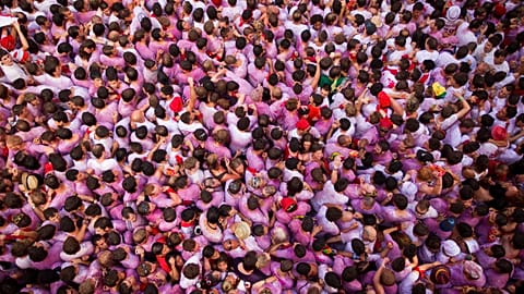 FILE - In this 6 July 2011 photo, revellers gather for the Chupinazo, marking the start of the 2011 San Fermín festival in Pamplona, Spain.