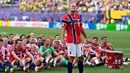 Norway's Erling Haaland (9) leads the team as they participate in a viking boat row after the World Cup round of 16 soccer match between Brazil and Norway.