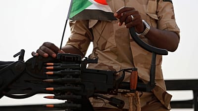 FILE - A Sudanese soldier from the Rapid Support Forces or RSF stands on his vehicle in the East Nile province, Sudan, on June 22, 2019