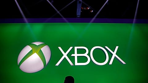 A man walks past the Xbox logo at the Microsoft booth during the E3 game show in Los Angeles, Tuesday, 11 June, 2013. 