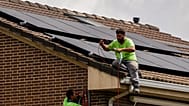 Workers install solar planers on the roof of a house in Rivas Vaciamadrid, Spain.