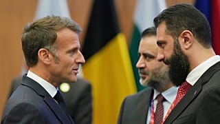 French President Emmanuel Macron, left, talks with the Syrian President Ahmad al-Sharaa during the EU Summit in Nicosia, Cyprus, April 24, 2026. 