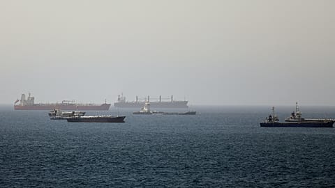 Tankers and cargo vessels are seen in the Gulf of Oman, along shipping routes linking the Strait of Hormuz and the Arabian Sea, Tuesday, June 16, 2026. 
