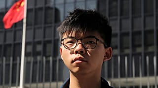 Pro-democracy activist Joshua Wong stands outside the Legislative Council building in Hong Kong, 28 November, 2019