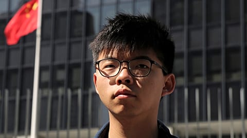 Pro-democracy activist Joshua Wong stands outside the Legislative Council building in Hong Kong, 28 November, 2019