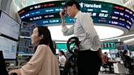 Currency traders watch monitors at the foreign exchange dealing room of the Hana Bank headquarters in Seoul, South Korea, 7 July 2026