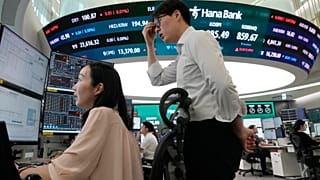 Currency traders watch monitors at the foreign exchange dealing room of the Hana Bank headquarters in Seoul, South Korea, 7 July 2026