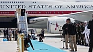 Staff lay a carpet on the tarmac before President Donald Trump exits Air Force One upon arriving for the NATO summit in Ankara, 7 July, 2026