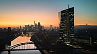 File - The sun has set behind the European Central Bank, right, in Frankfurt, Germany, Wednesday, 5 March 2025, the day before the meeting of the ECB's governing council.