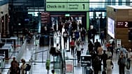 Passengers in a terminal at Berlin's Brandenburg airport, in Schönefeld, Germany, Saturday Sept. 20, 2025, after a cyberattack targeting check-in and boarding systems disrupte