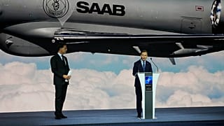 NATO Secretary General Mark Rutte, listens, as Sweden's Prime Minister Ulf Kristersson speaks at the opening of the NATO Defense Industry Forum.