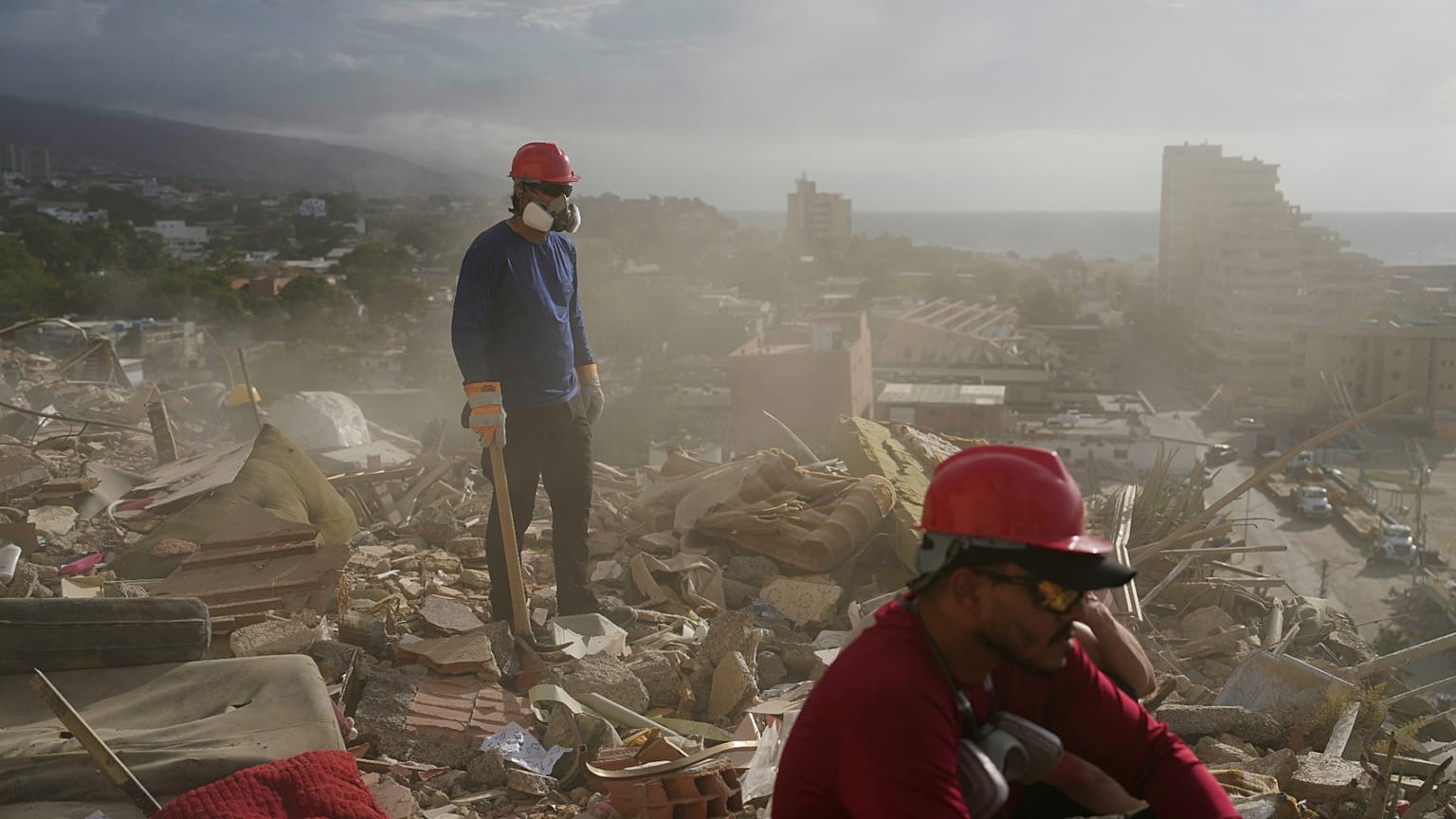 Rescue teams and volunteers search the rubble of a building that collapsed during the earthquakes in La Guaira, Venezuela, on Monday 6 July 2026.