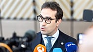 Spain's Economy Minister Carlos Cuerpo Caballero speaks with the media ahead of a Eurogroup meeting in Brussels, May 2026
