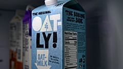 A carton of Oatly oat milk sits in a home refrigerator Tuesday, May 18, 2021, in Bellingham, Wash. Oatly, the world’s largest oat milk company
