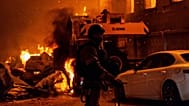 Emergency services personnel work to extinguish a fire following a Russian air attack in Kyiv, Ukraine, Wednesday, July 8, 2026. 