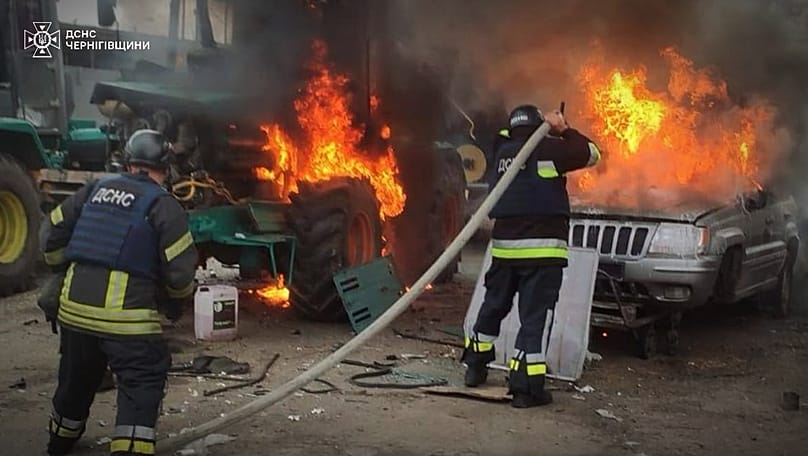 Emergency services personnel work to extinguish a fire following a Russian air attack in Chernihiv, Ukraine, Wednesday, July 8, 2026. 