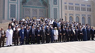 Forum participants pose for a group photo.