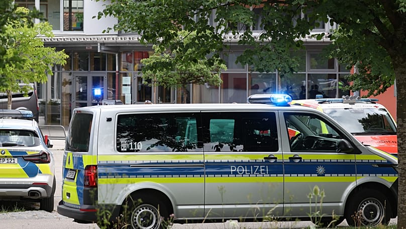 Police vehicles parked in front of the Welfen High School in Schongau, 8 July, 2026