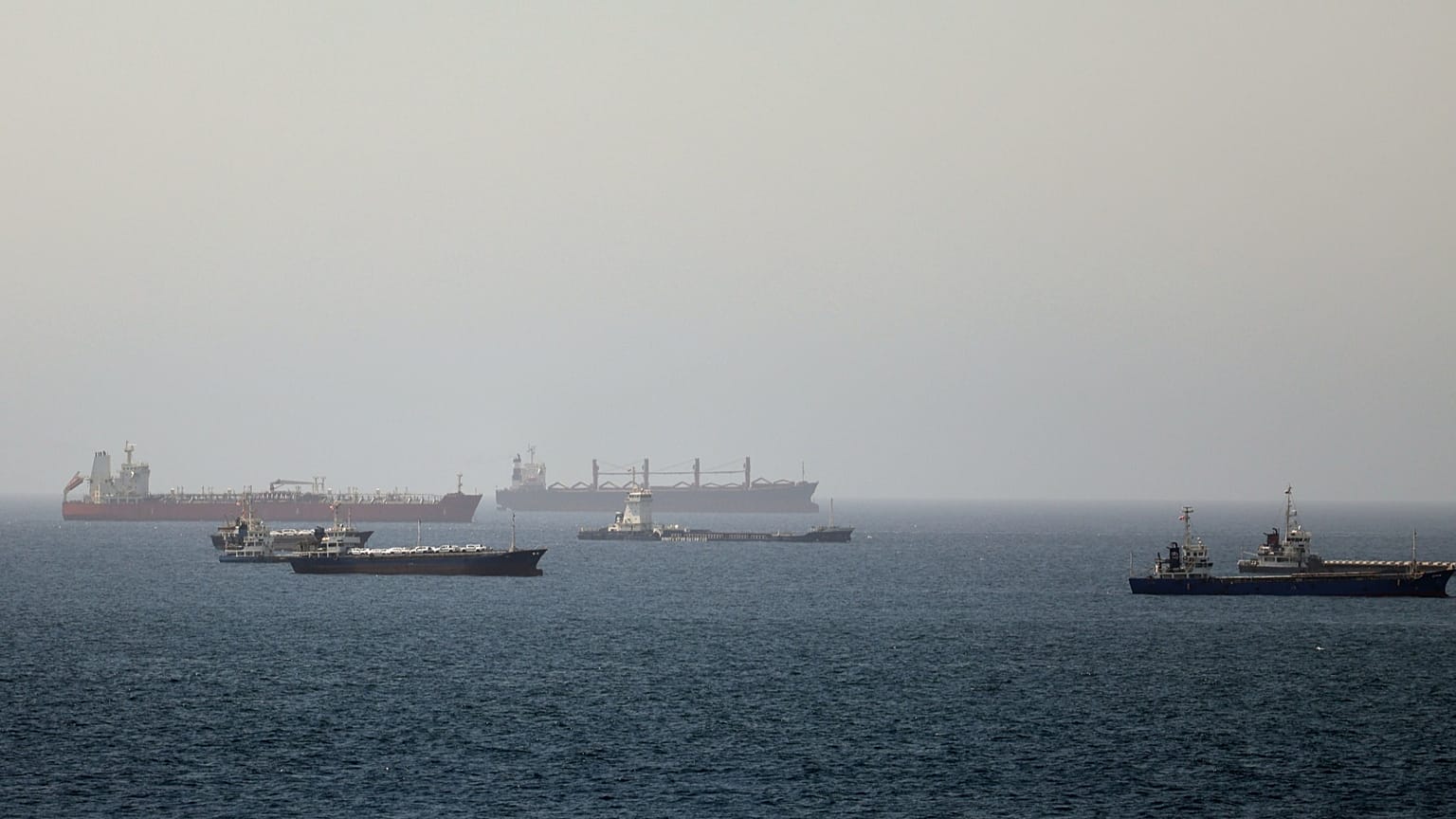 Tankers and cargo vessels are seen in the Gulf of Oman, 16 June, 2026