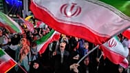 Demonstrators wave Iranian flags in a pro-government gathering in Tehran, 7 June, 2026
