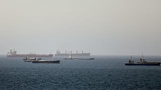 Tankers and cargo vessels are seen in the Gulf of Oman, 16 June, 2026