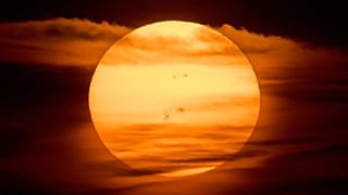 The sun rises over Frankfurt, Germany.