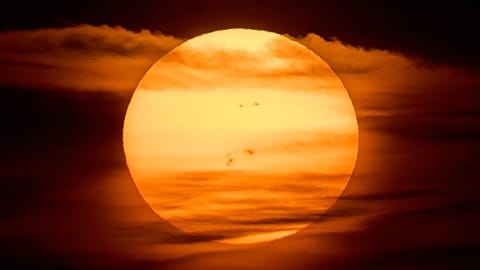 The sun rises over Frankfurt, Germany.