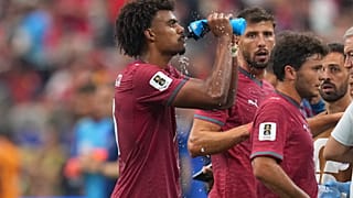 Portugal's Renato Veiga (13) drinks water during a hydration break of the World Cup round of 16 soccer match between Portugal and Spain 
